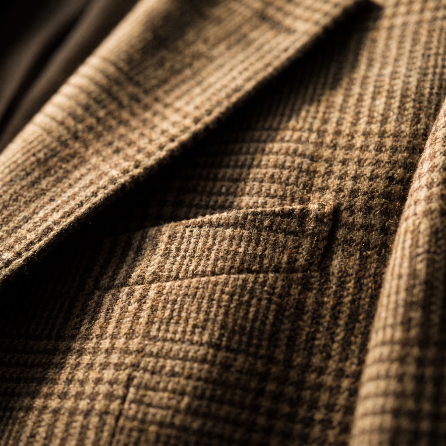 Macro detail of sport coat fabric weave and stitching