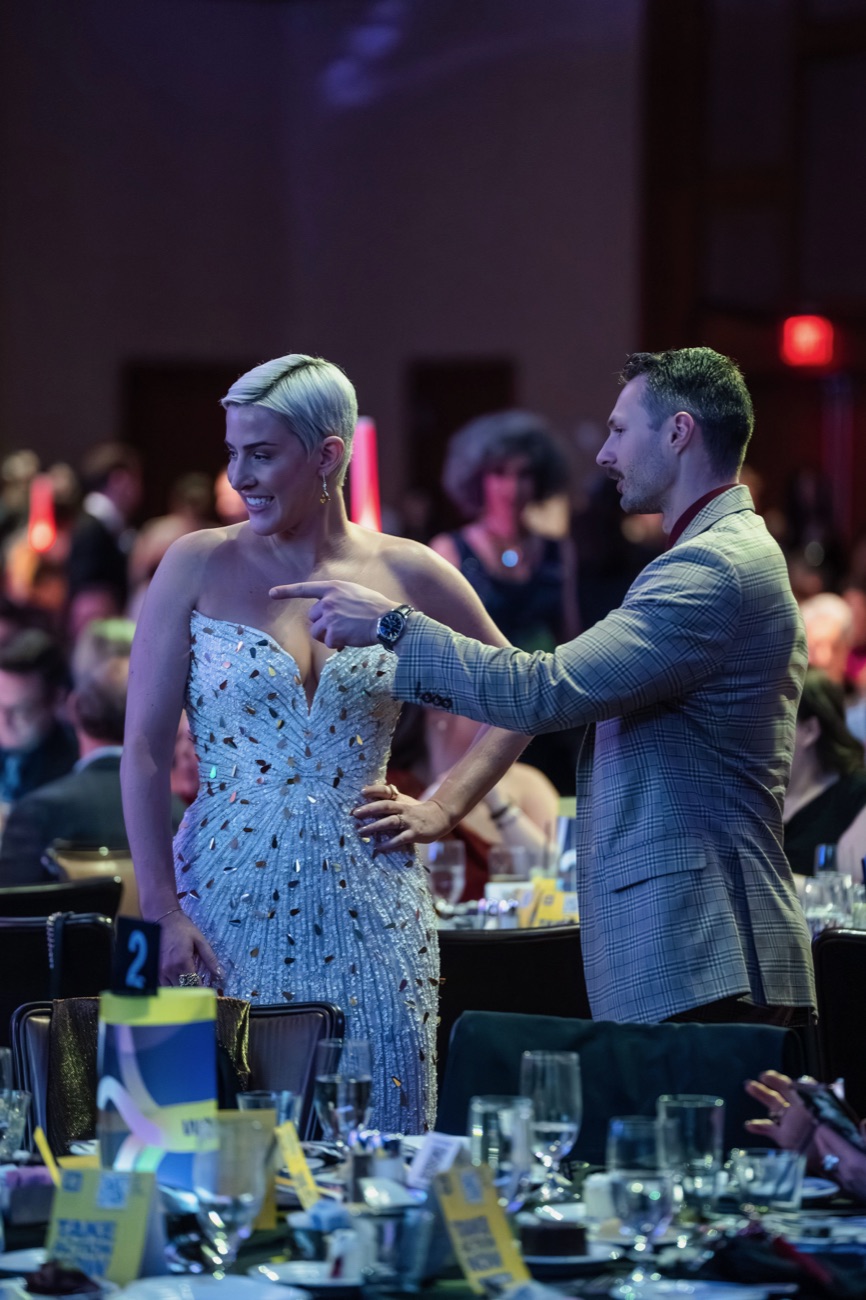 Curtis styling a client at a gala